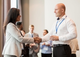 Two people shaking hands - how to build trust in a workplace relationship.